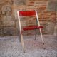 Red Plexiglas folding chair