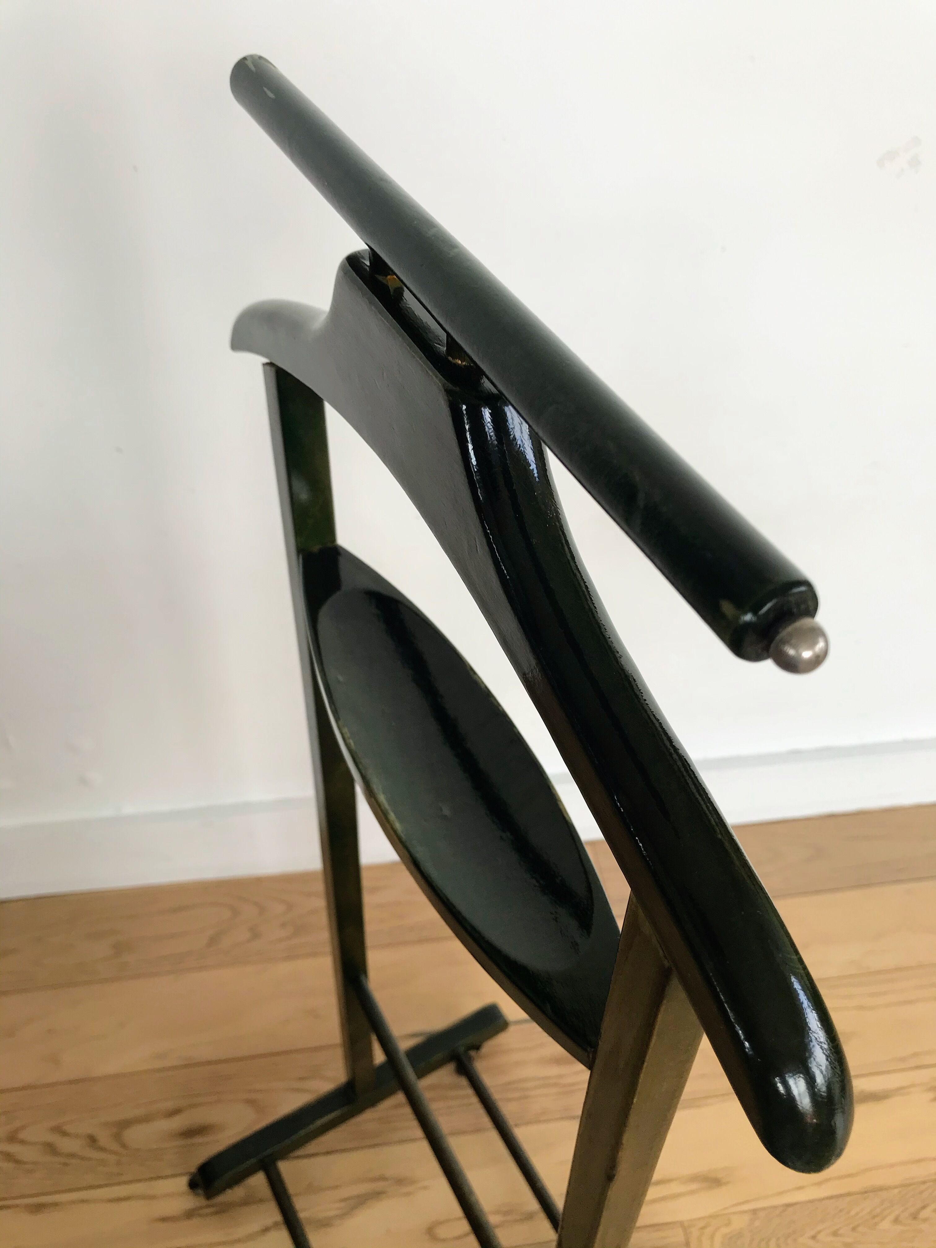 Vintage children's room valet in green varnished wood on roulette