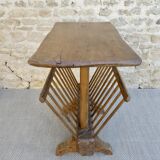 Pedestal table magazine in carved wood with gouge, mountain
