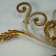 Pair of large floral wall lamps in gilded and lacquered metal. Italy 1960s