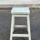 Rustic square farmhouse stool in patinated white wood from the 1960s.