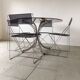 1970s Italian dining table in smoked glass and chrome.