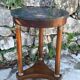 Empire style mahogany and mahogany veneer tripod pedestal table