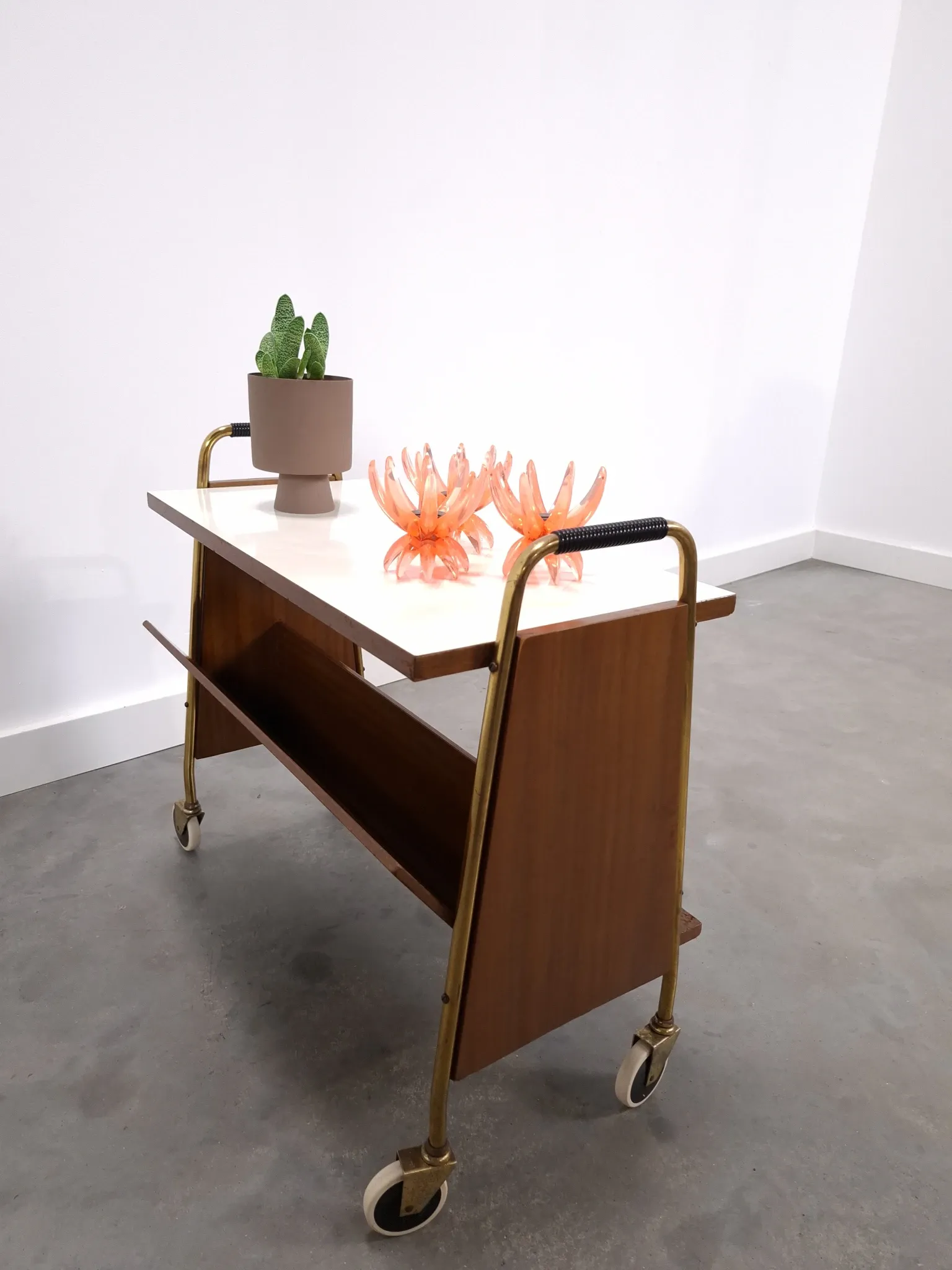 Vintage 1950s side table with a reading basket, formica top, teak wood.