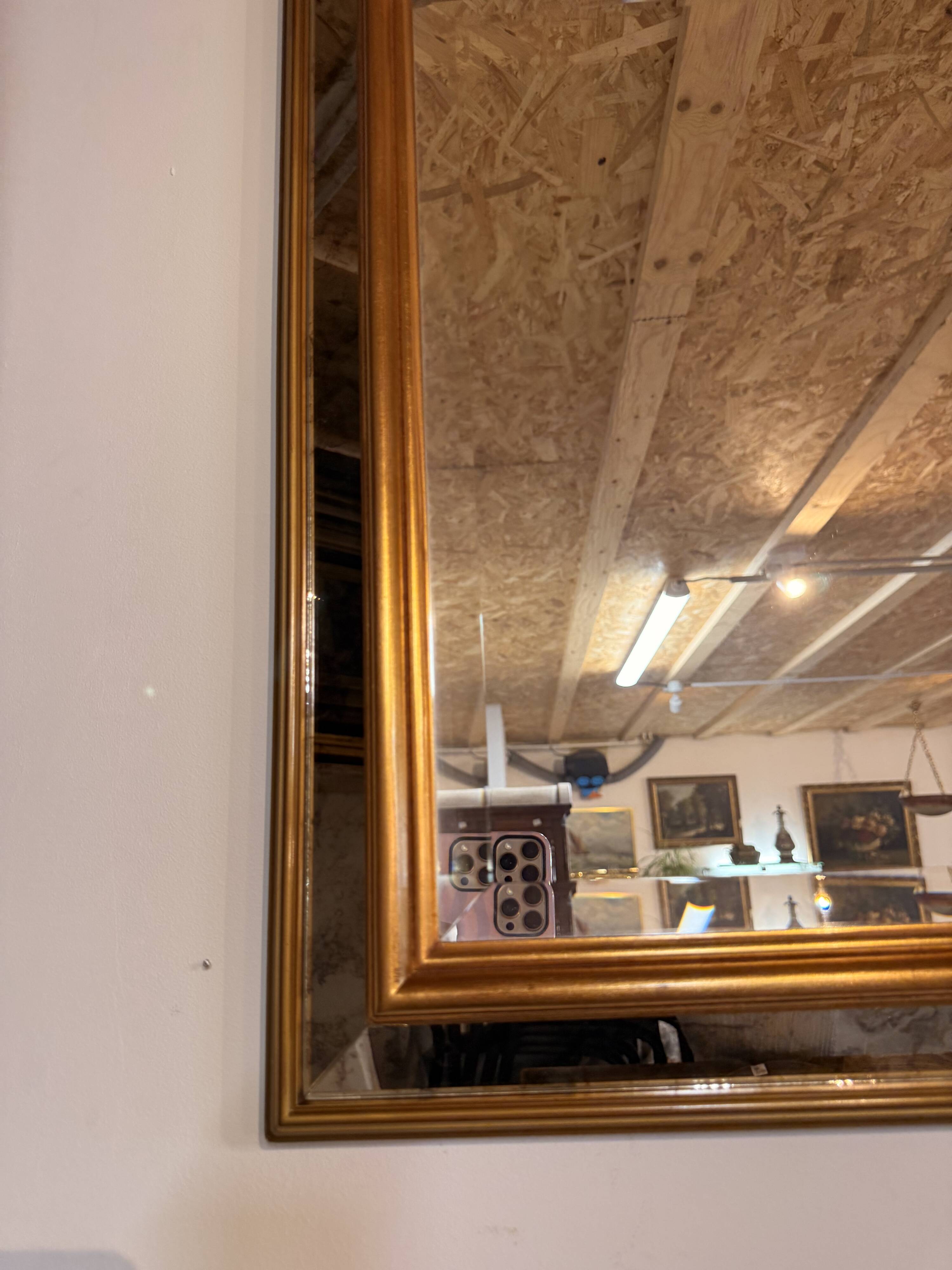 Grand miroir biseauté – cadre doré – années 1970