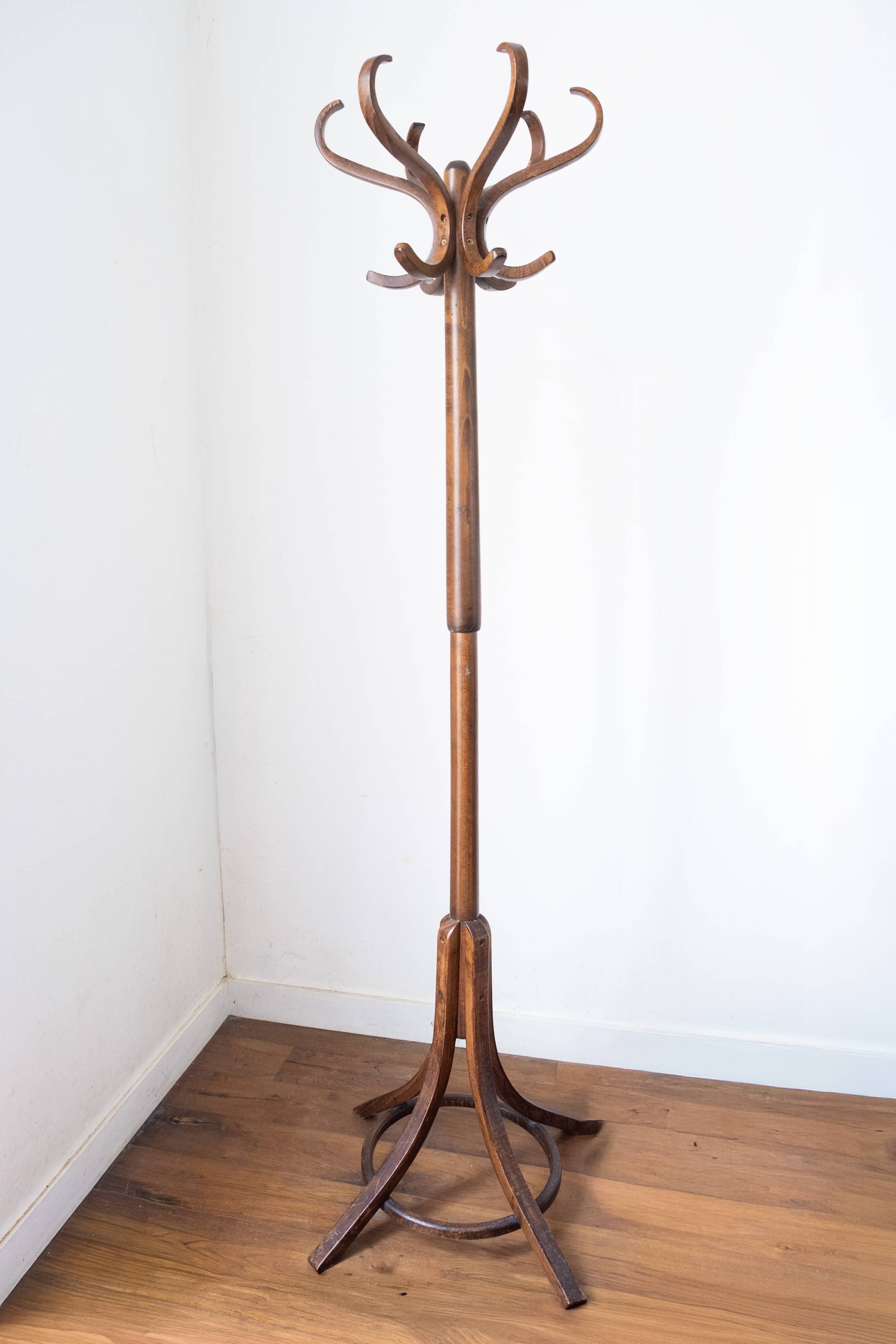 Baumann swivel parrot coat rack, dark wood.