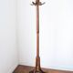 Baumann swivel parrot coat rack, dark wood.
