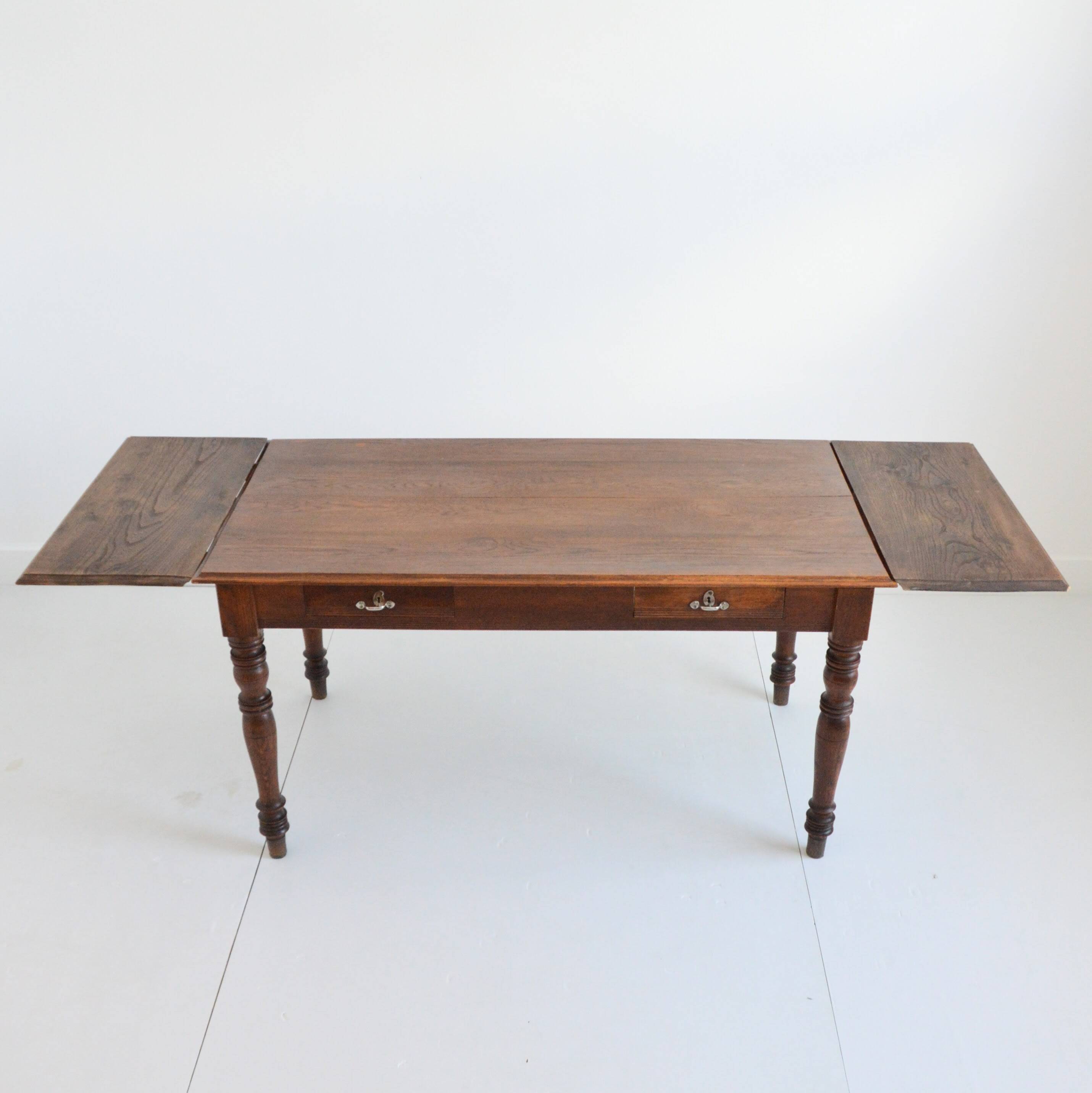 Farm table with extensions from the early 20th century.