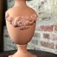 Terracotta lamp decorated with fruit crown