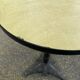 Round bistro table in cast iron and Bakelite, Louis Vuitton style, 1930s.