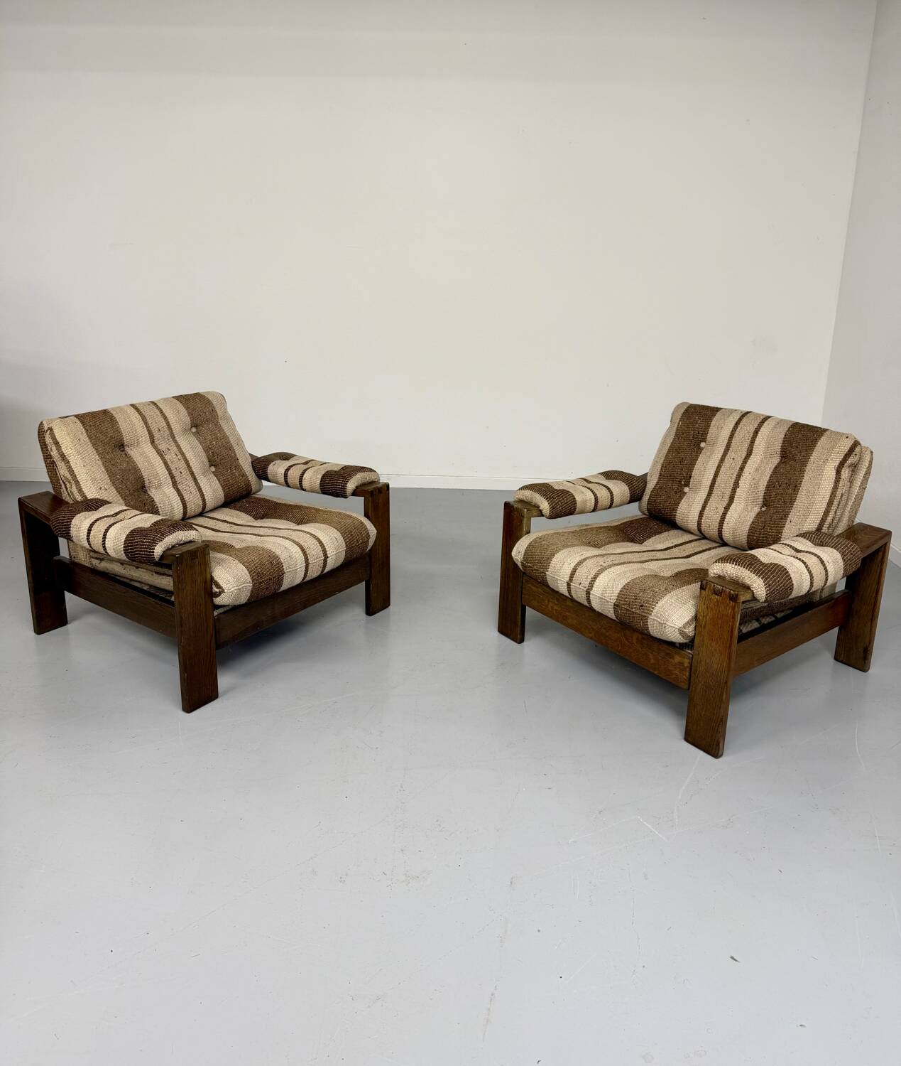 2 vintage 1970s wooden and fabric armchairs