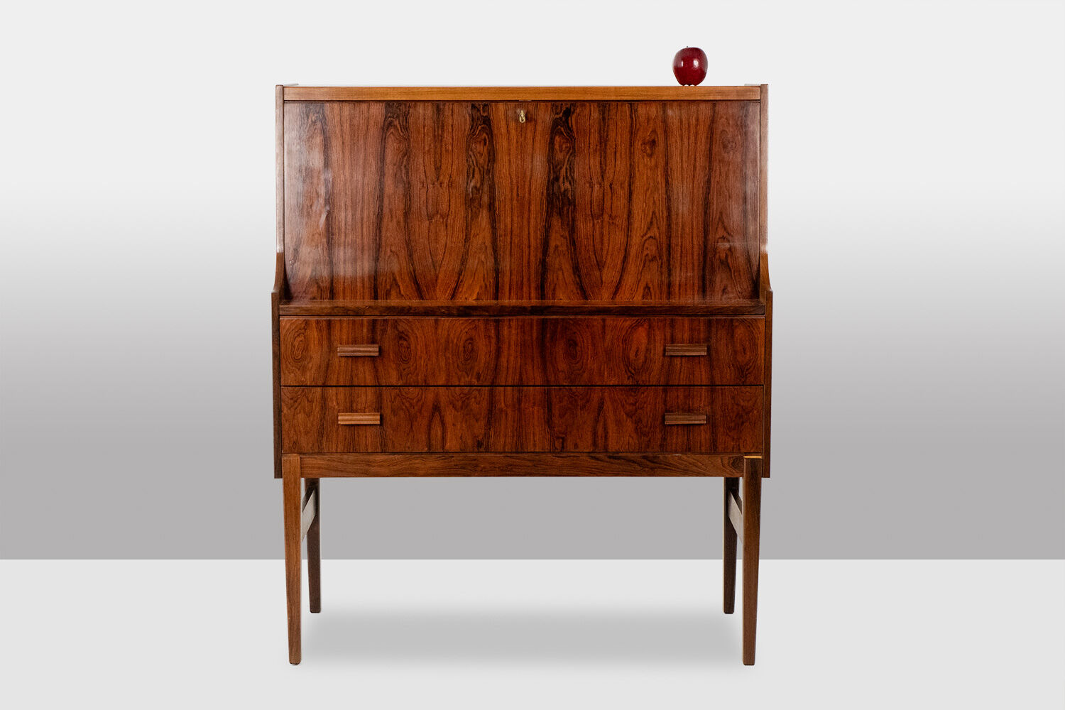 Rosewood chest of drawers with 2 drawers, forming a secretary. 1970s.