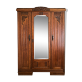 Old solid wood wardrobe with three vintage mirror doors