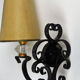 1950 gold star and black metal sconces