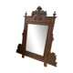 Antique wooden commode with marble top and mirror.