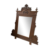 Antique wooden commode with marble top and mirror.