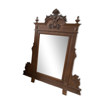 Antique wooden commode with marble top and mirror.