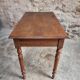 Antique French writing table in walnut with a drawer, circa 1900.