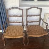 Pair of antique wooden armchairs with woven seats + cushions