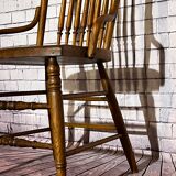 Wooden armchair with high back