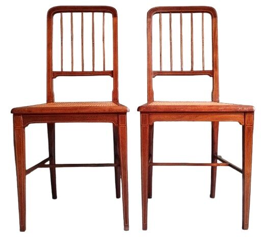 Pair of caned mahogany chairs, circa 1930.