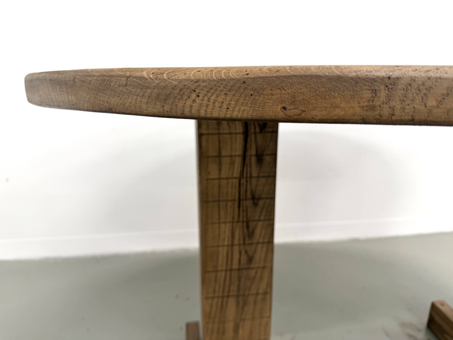 Oval table with T-shaped legs, solid oak, student woodworking project.
