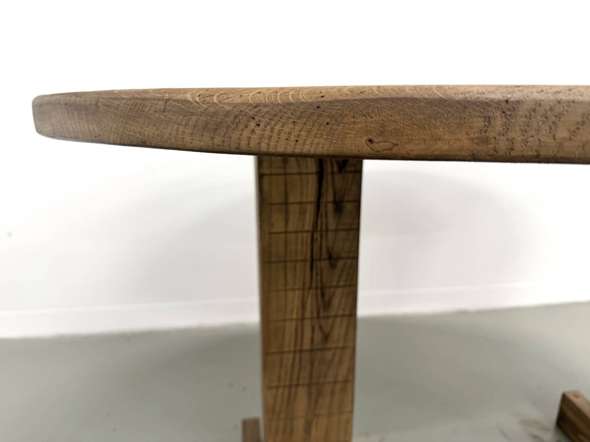 Oval table with T-shaped legs, solid oak, student woodworking project.