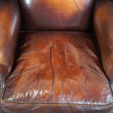 Beautiful classic and stately wingback armchair made of sheep leather with beautiful colors