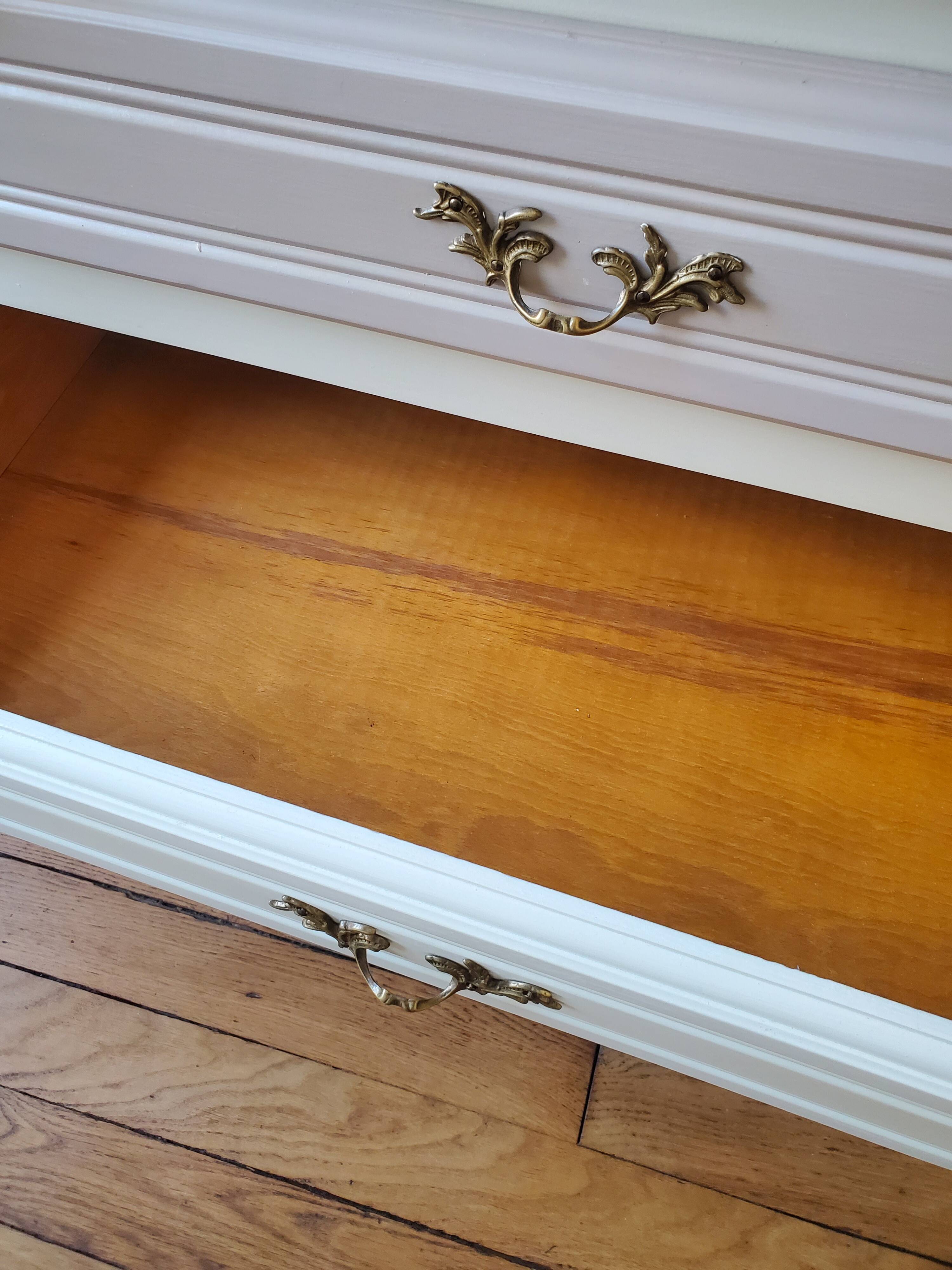 Dresser repainted in off-white and grey-pink colours.