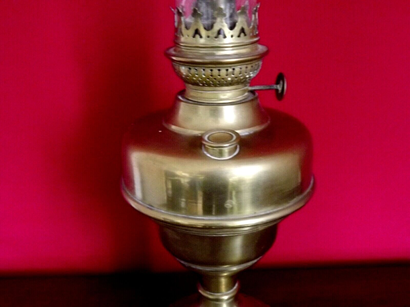 Vintage brass oil lantern with decorative base and transparent glass funnel stamped L B Brand Delay 4399.