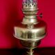 Vintage brass oil lantern with decorative base and transparent glass funnel stamped L B Brand Delay 4399.