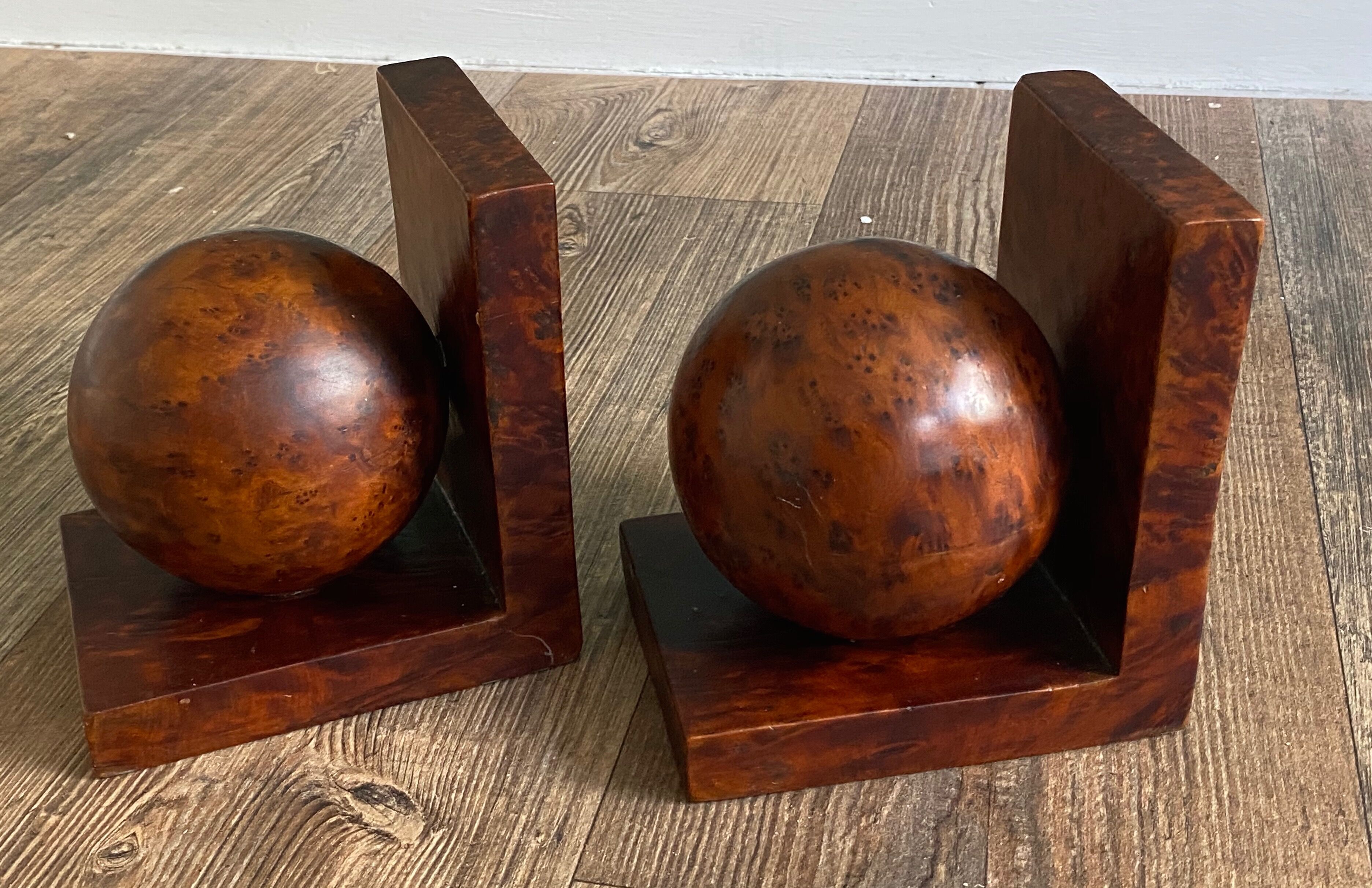 Pair of bookends adorned with spheres