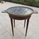 Gray marble mahogany pedestal table and brass gallery