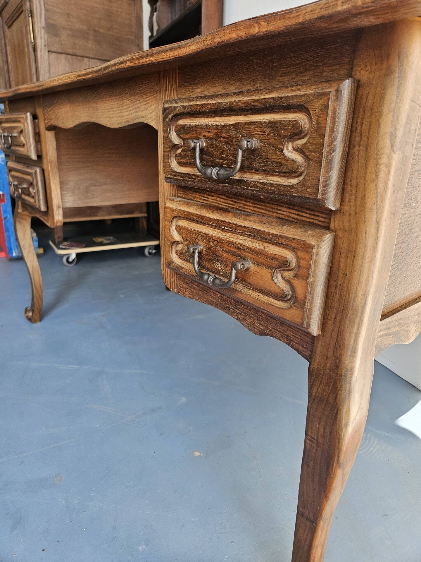 Antique wooden desk with 4 drawers.