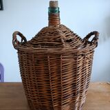 Dame Jeanne in her wicker and rattan clothing