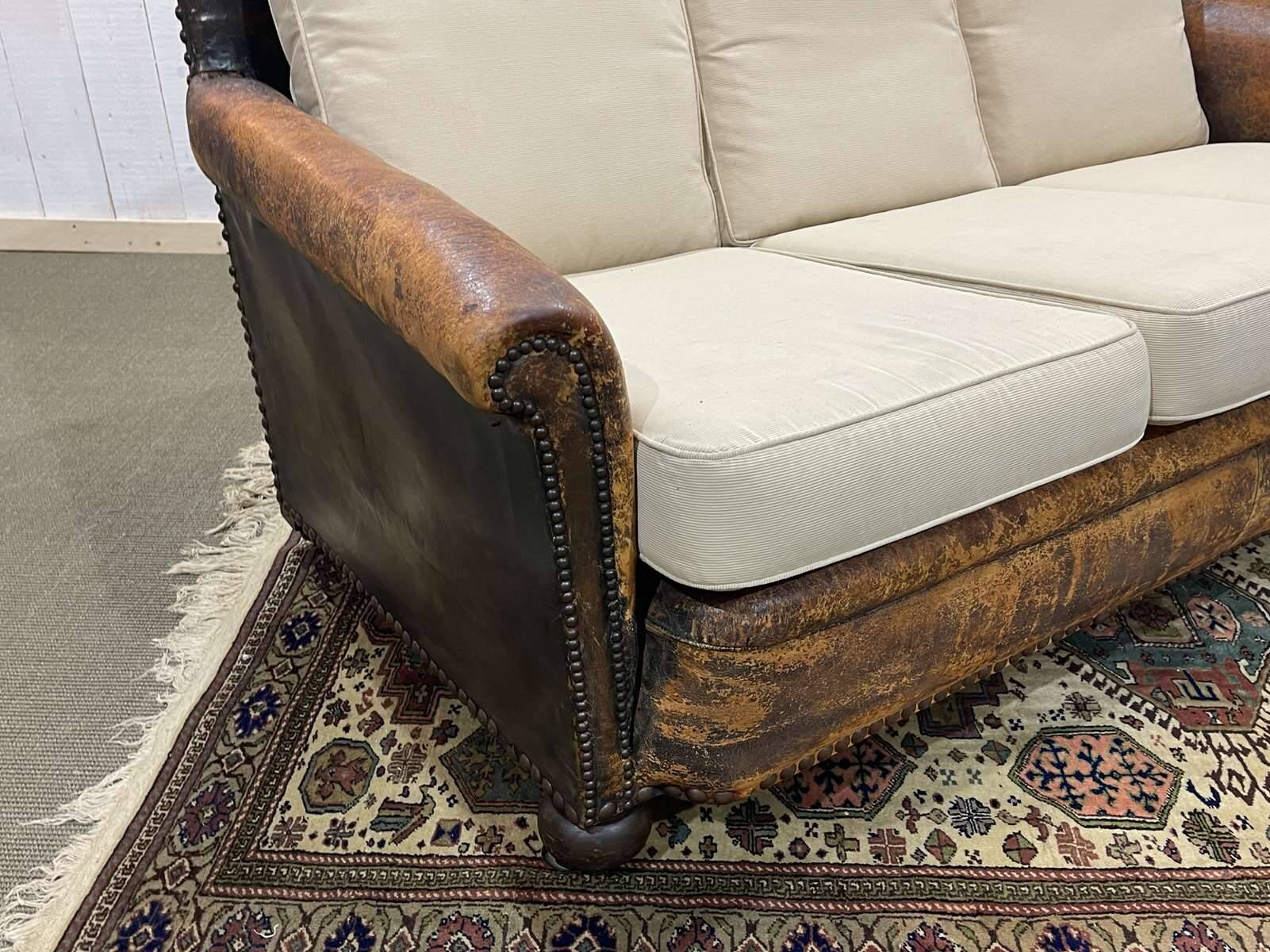 Early 20th century leather club sofa - seat and back in modern fabric