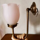 Brass wall lamp with pale pink bell