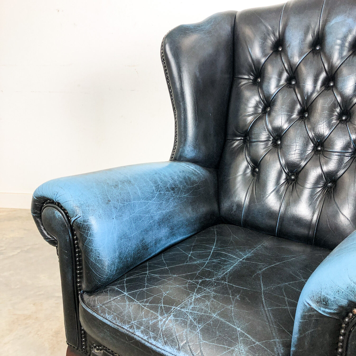 Vintage blue leather chesterfield armchair