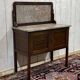 English toilet furniture in mahogany and marble from the early 20th century.