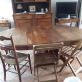 Old table slightly oval cherry tree with central foot with 2 extensions