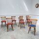 Huit chaises Baumann à assise colorée