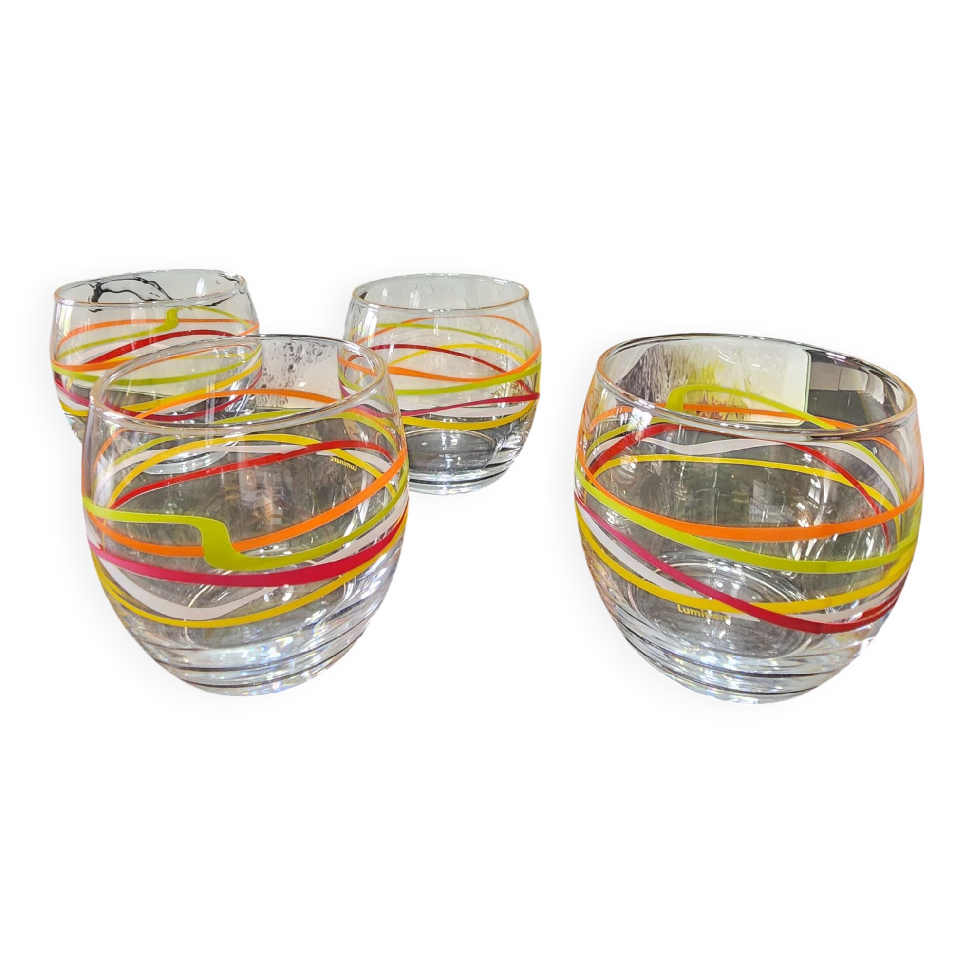 4 vintage Luminarc water glasses with coloured spiral line patterns.