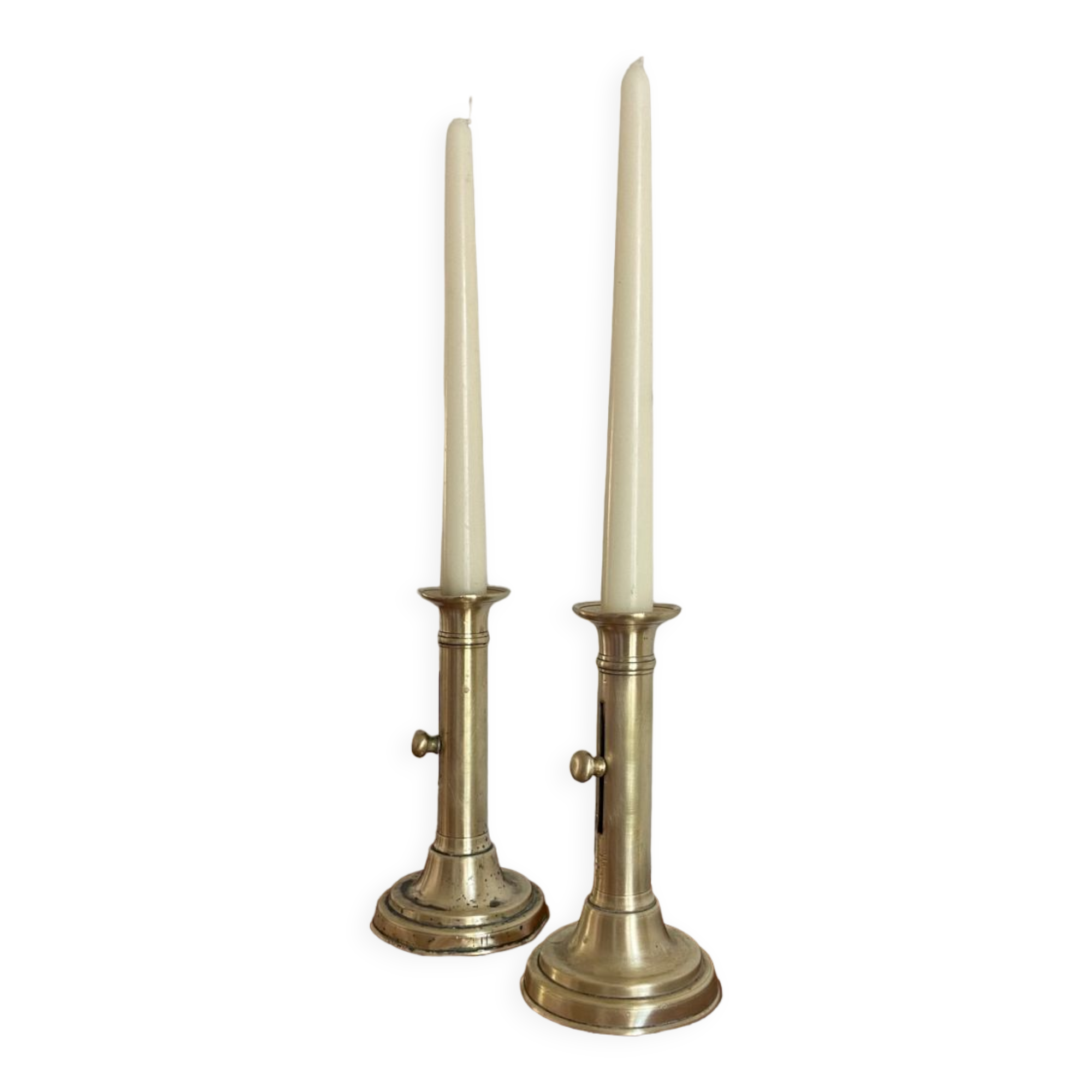 Pair of antique brass push candlesticks