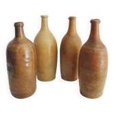 4 old stoneware bottles