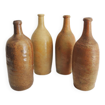 4 old stoneware bottles