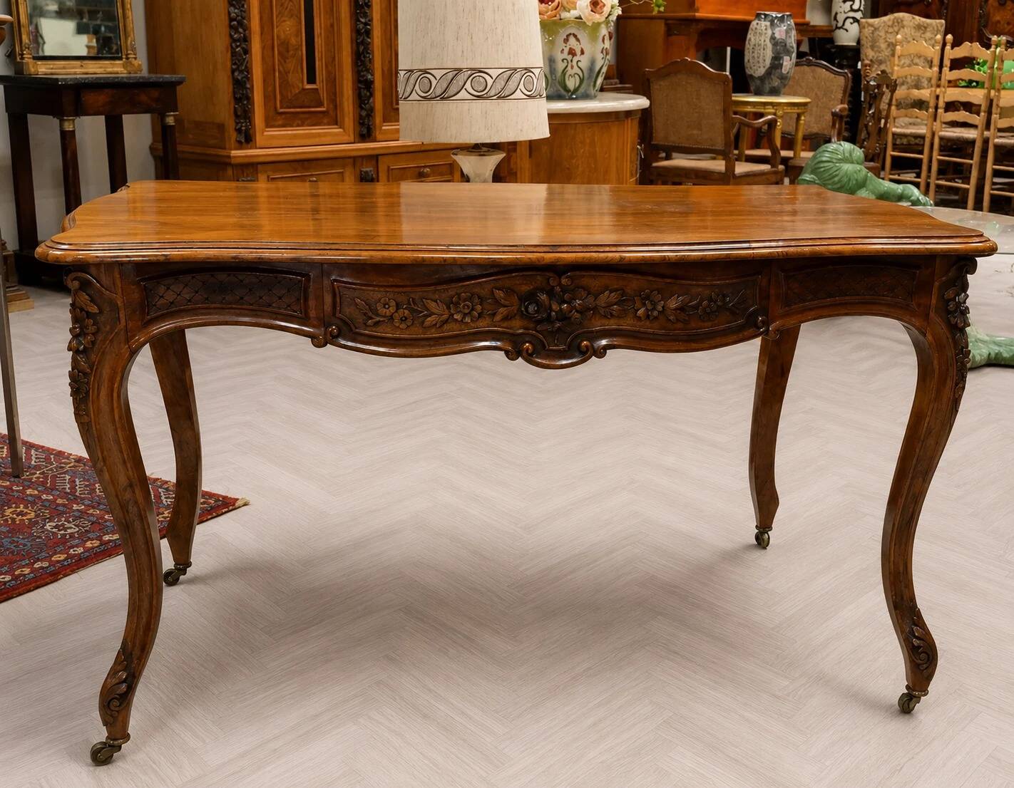 Curved desk in Louis XV style, made of carved and moulded walnut.