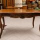 Curved desk in Louis XV style, made of carved and moulded walnut.