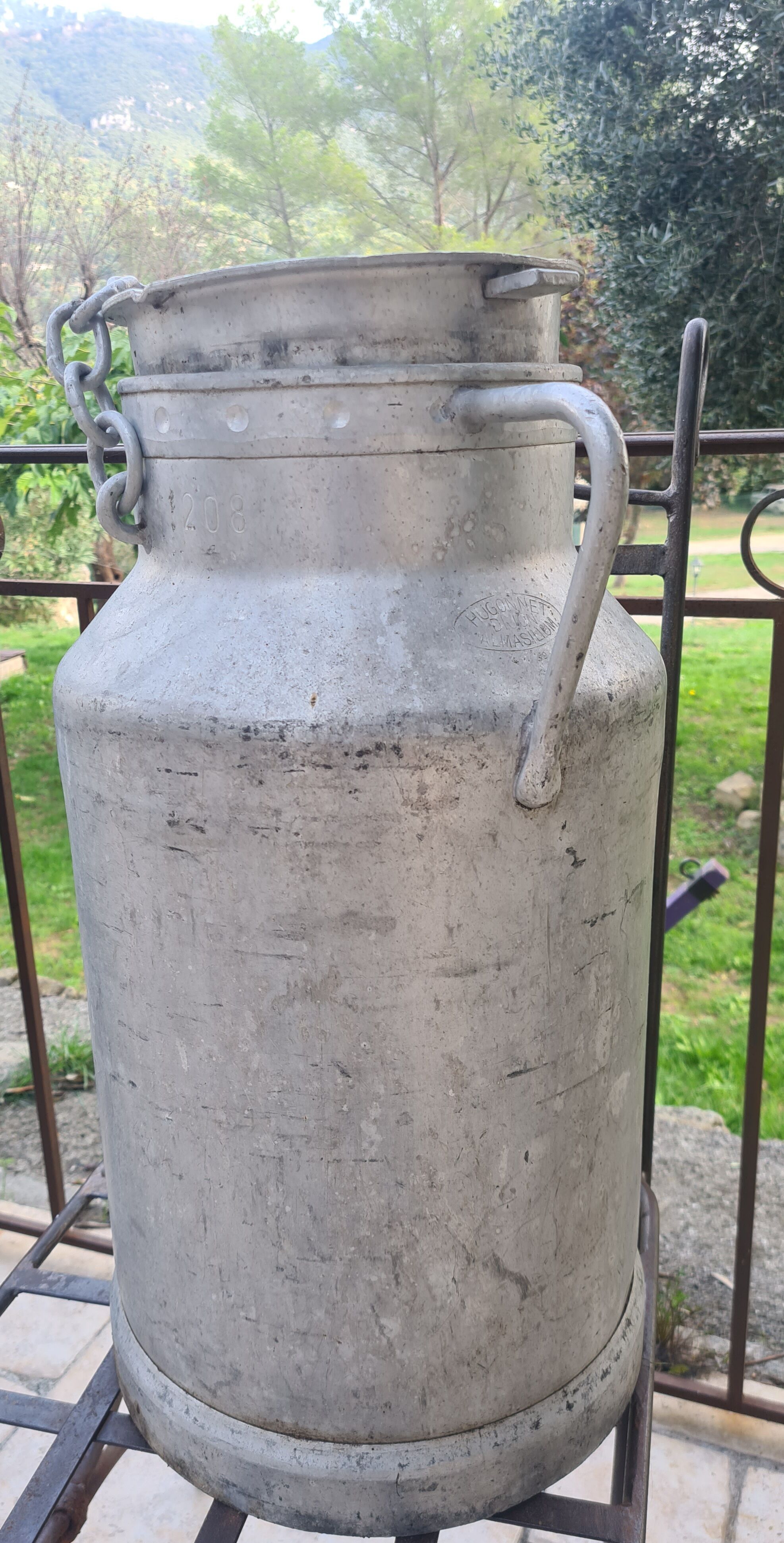 set of 2 old aluminum milk jugs