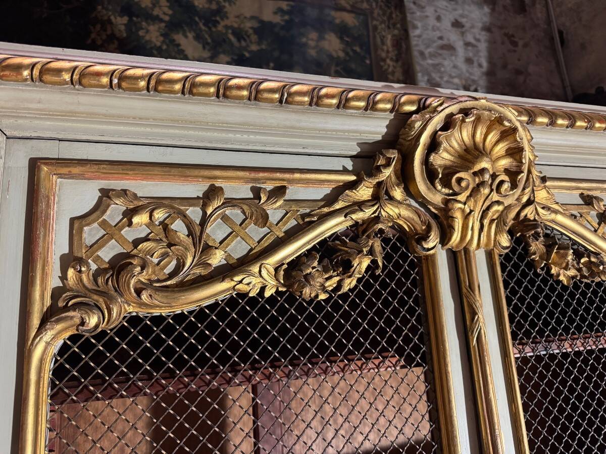 Bookcase in gilded wood and restored wood from the Napoleonic III period.
