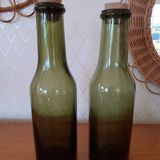 Pair of green bottles made of bubbled blown glass